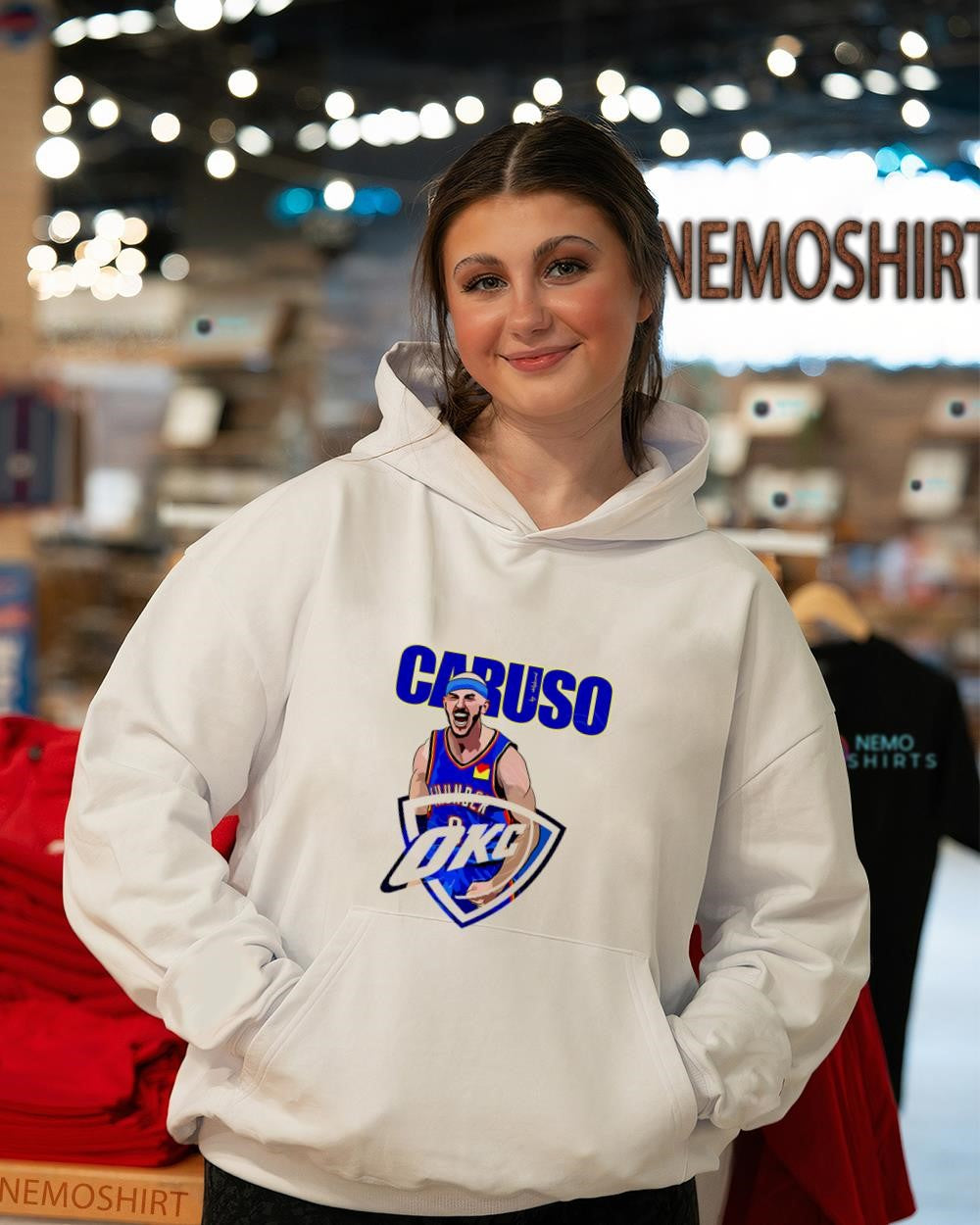 Alex Caruso in an Oklahoma City Thunder jersey superimposed logo shirt