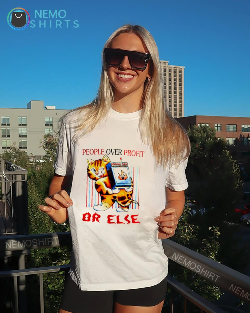 Cat carrying giant matchbox people over profit or else shirt