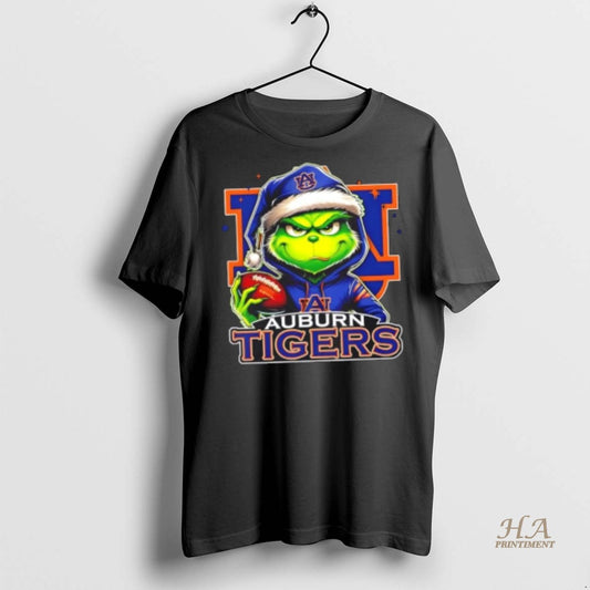 Official Grinch Is Holding A Ball And Smiling At Auburn Tigers Fans Christmas Shirt