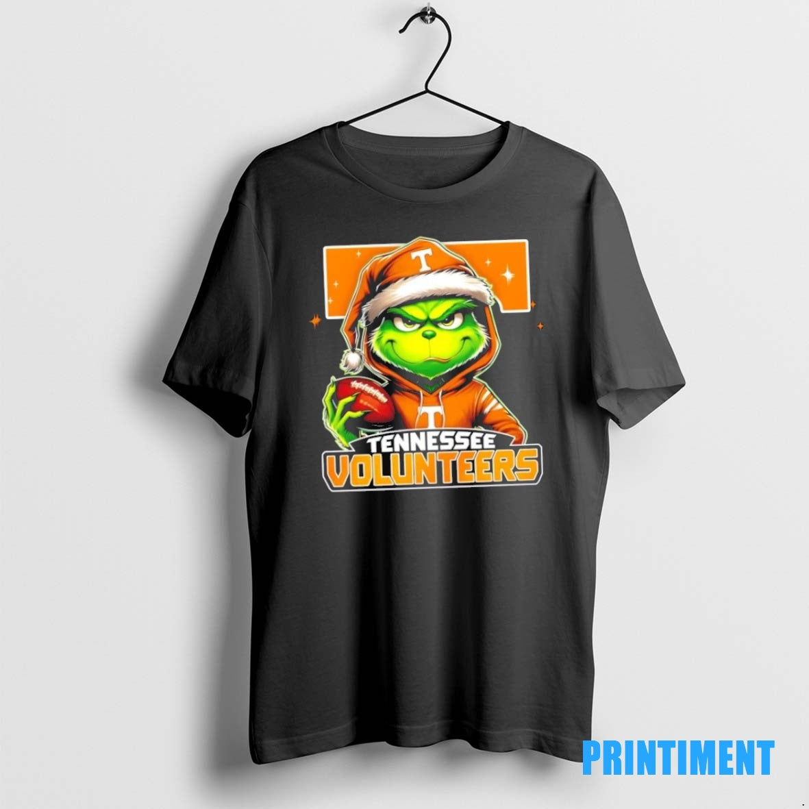 Official Grinch Is Holding A Ball And Smiling At Tennessee Volunteers Fans Christmas Tee Sweater
