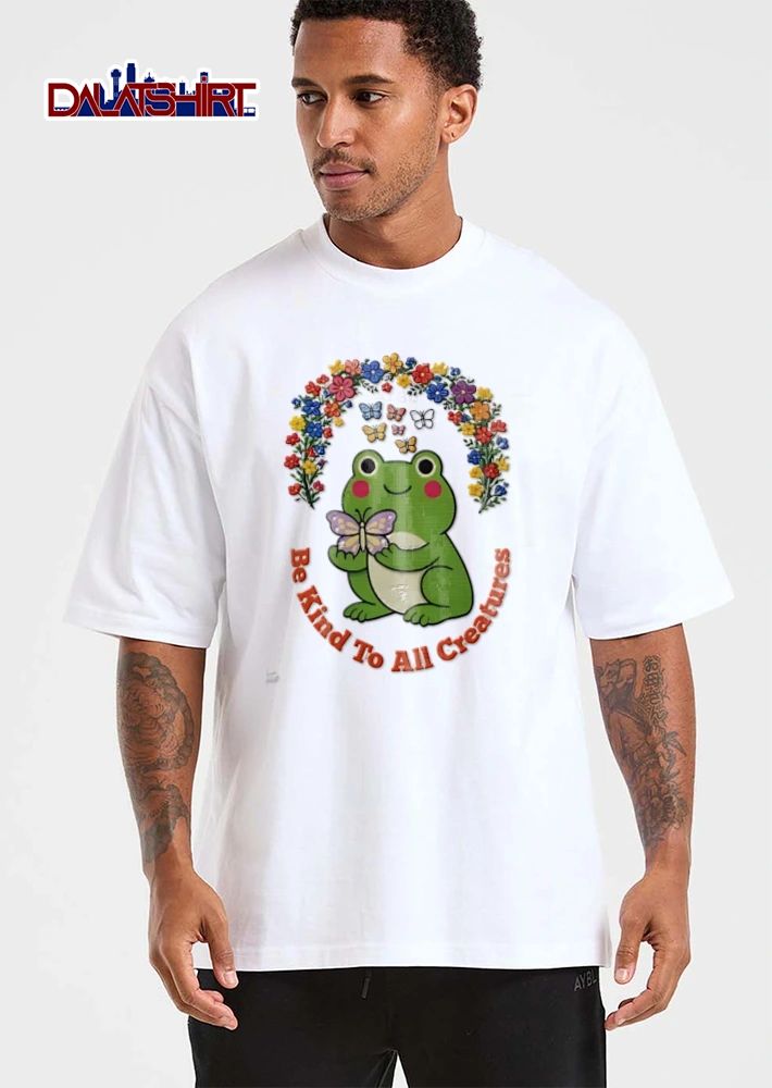 Be Kind To All Creatures green frog holding purple butterfly shirt
